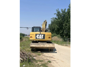 Tekerlekli ekskavatör CATERPILLAR