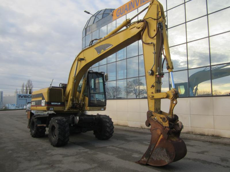 Caterpillar M315 - Tekerlekli ekskavatör: fotoğraf 1 Caterpillar M315 - Tekerlekli ekskavatör: fotoğraf 1
