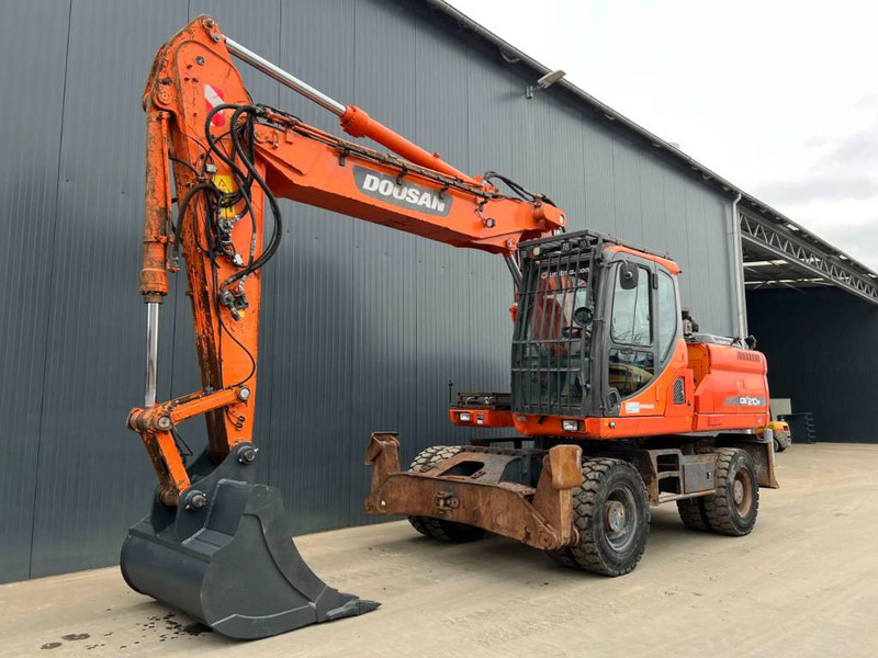 Doosan DX210W - Tekerlekli ekskavatör: fotoğraf 1 Doosan DX210W - Tekerlekli ekskavatör: fotoğraf 1
