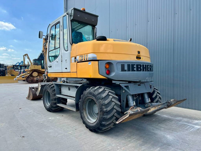 Liebherr A311 Litronic - Tekerlekli ekskavatör: fotoğraf 2 Liebherr A311 Litronic - Tekerlekli ekskavatör: fotoğraf 2