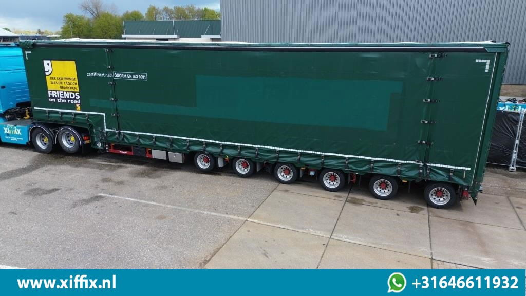 Meusburger 6-ass. Semi dieplader met elektische huifopbouw / 3x naloop gestuurd - Alçak çerçeveli platform dorse: fotoğraf 2 Meusburger 6-ass. Semi dieplader met elektische huifopbouw / 3x naloop gestuurd - Alçak çerçeveli platform dorse: fotoğraf 2