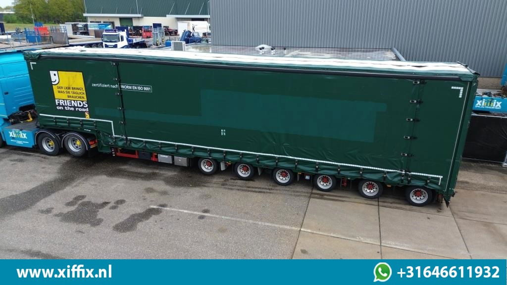 Meusburger 6-ass. Semi dieplader met elektrische huifopbouw / 3x naloop gestuurd - Alçak çerçeveli platform dorse: fotoğraf 2 Meusburger 6-ass. Semi dieplader met elektrische huifopbouw / 3x naloop gestuurd - Alçak çerçeveli platform dorse: fotoğraf 2