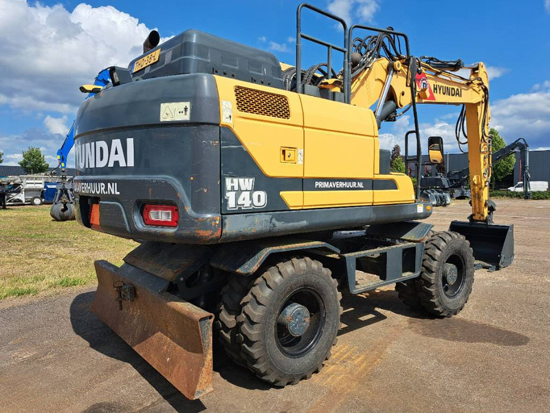 Hyundai HW140 - Tekerlekli ekskavatör: fotoğraf 3 Hyundai HW140 - Tekerlekli ekskavatör: fotoğraf 3