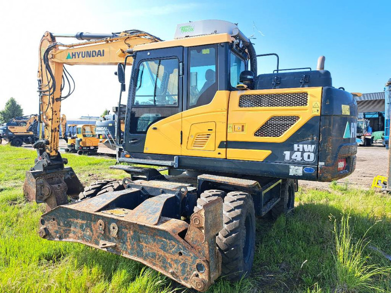 Hyundai HW140 - Tekerlekli ekskavatör: fotoğraf 3 Hyundai HW140 - Tekerlekli ekskavatör: fotoğraf 3