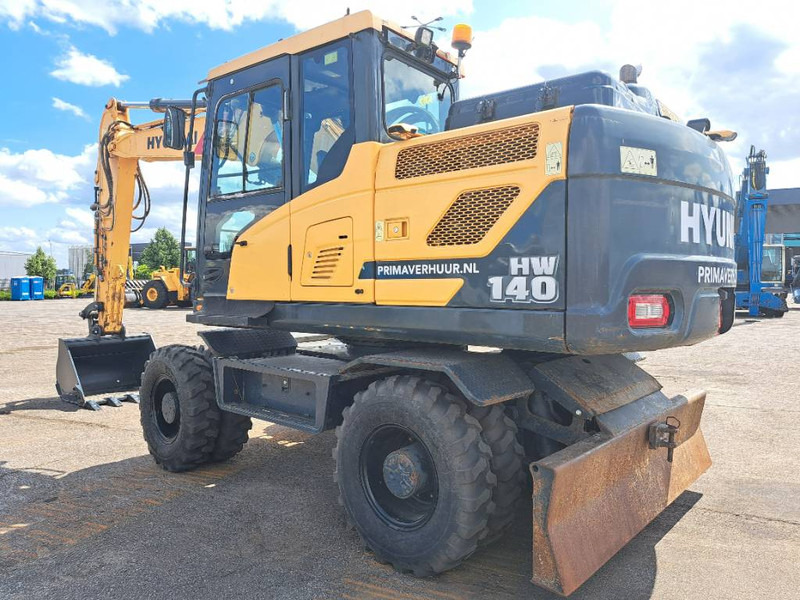Hyundai HW140 - Tekerlekli ekskavatör: fotoğraf 1 Hyundai HW140 - Tekerlekli ekskavatör: fotoğraf 1