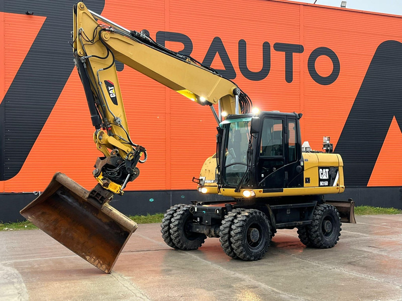 Caterpillar M316D / ROTOTILT/ AC / CENTRAL LUBRICATION / + EXTRA BUCKET - Tekerlekli ekskavatör: fotoğraf 1 Caterpillar M316D / ROTOTILT/ AC / CENTRAL LUBRICATION / + EXTRA BUCKET - Tekerlekli ekskavatör: fotoğraf 1