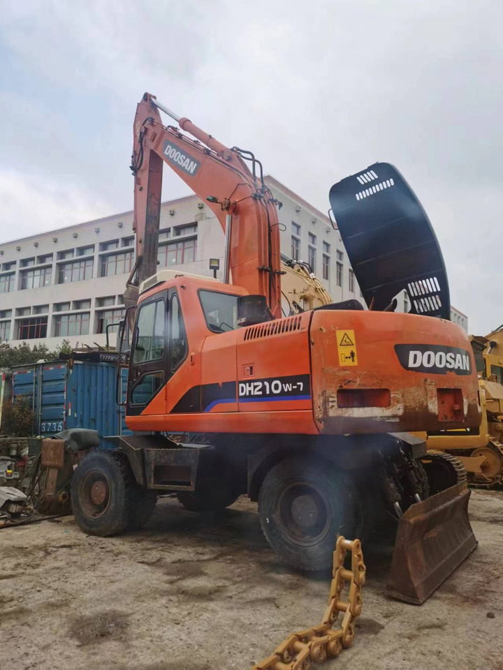 DOOSAN DH210W-7 - Tekerlekli ekskavatör: fotoğraf 1 DOOSAN DH210W-7 - Tekerlekli ekskavatör: fotoğraf 1