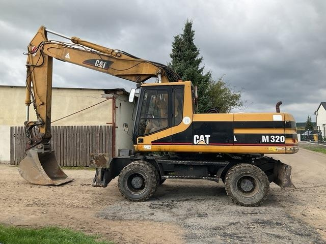CAT M320 - Tekerlekli ekskavatör: fotoğraf 1 CAT M320 - Tekerlekli ekskavatör: fotoğraf 1