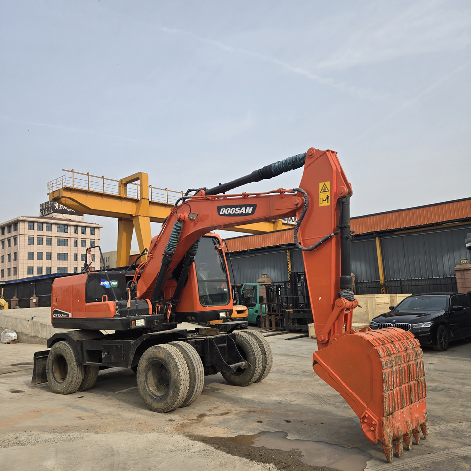 DOOSAN DX150W - Tekerlekli ekskavatör: fotoğraf 1 DOOSAN DX150W - Tekerlekli ekskavatör: fotoğraf 1