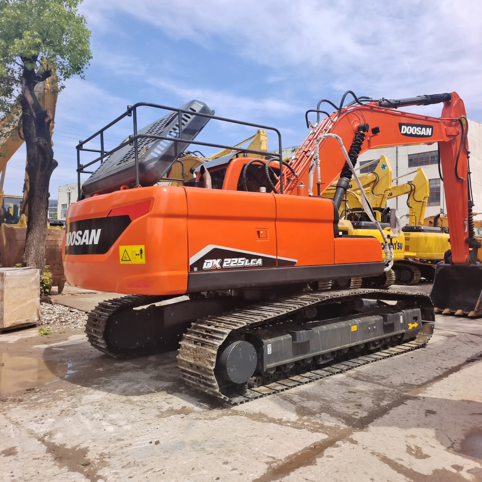 DOOSAN DX225 - Paletli ekskavatör: fotoğraf 1 DOOSAN DX225 - Paletli ekskavatör: fotoğraf 1