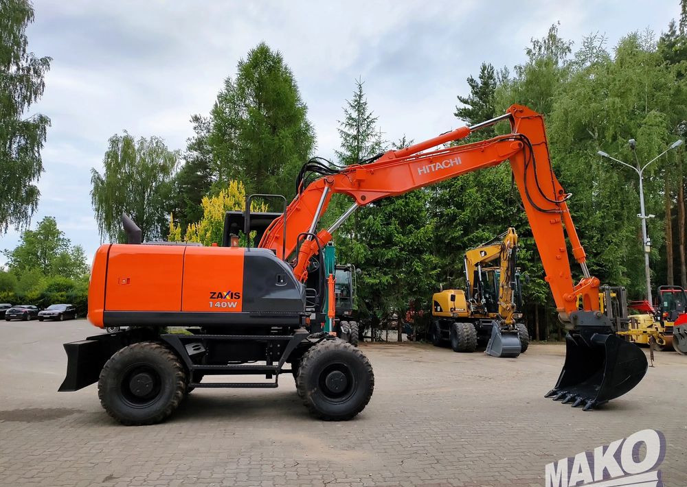 Hitachi ZX 140 - Tekerlekli ekskavatör: fotoğraf 5 Hitachi ZX 140 - Tekerlekli ekskavatör: fotoğraf 5
