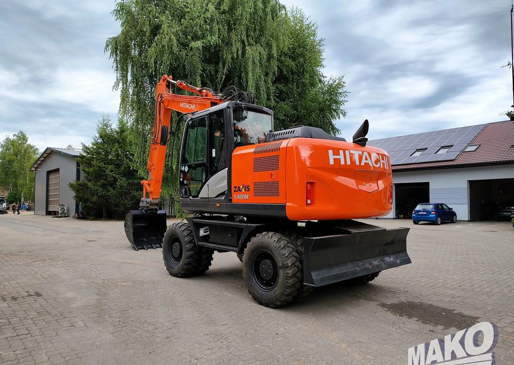 Hitachi ZX 140 - Tekerlekli ekskavatör: fotoğraf 2 Hitachi ZX 140 - Tekerlekli ekskavatör: fotoğraf 2