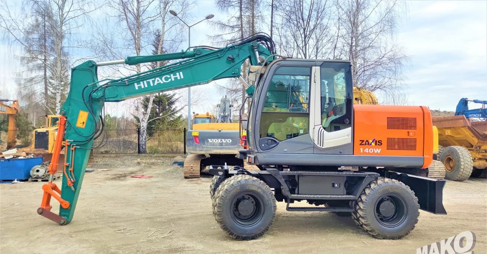 Hitachi ZX140W-3 - Tekerlekli ekskavatör: fotoğraf 1 Hitachi ZX140W-3 - Tekerlekli ekskavatör: fotoğraf 1