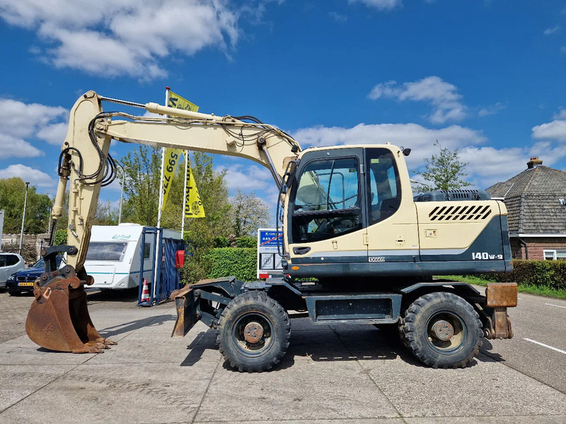 Hyundai Robex 140W-9 met airco - Tekerlekli ekskavatör: fotoğraf 1 Hyundai Robex 140W-9 met airco - Tekerlekli ekskavatör: fotoğraf 1