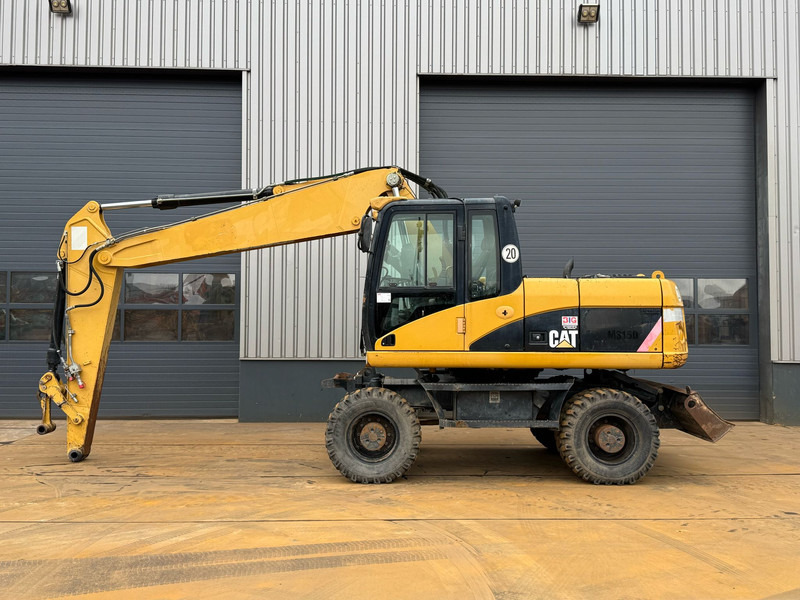 Caterpillar M315D - Tekerlekli ekskavatör: fotoğraf 1 Caterpillar M315D - Tekerlekli ekskavatör: fotoğraf 1