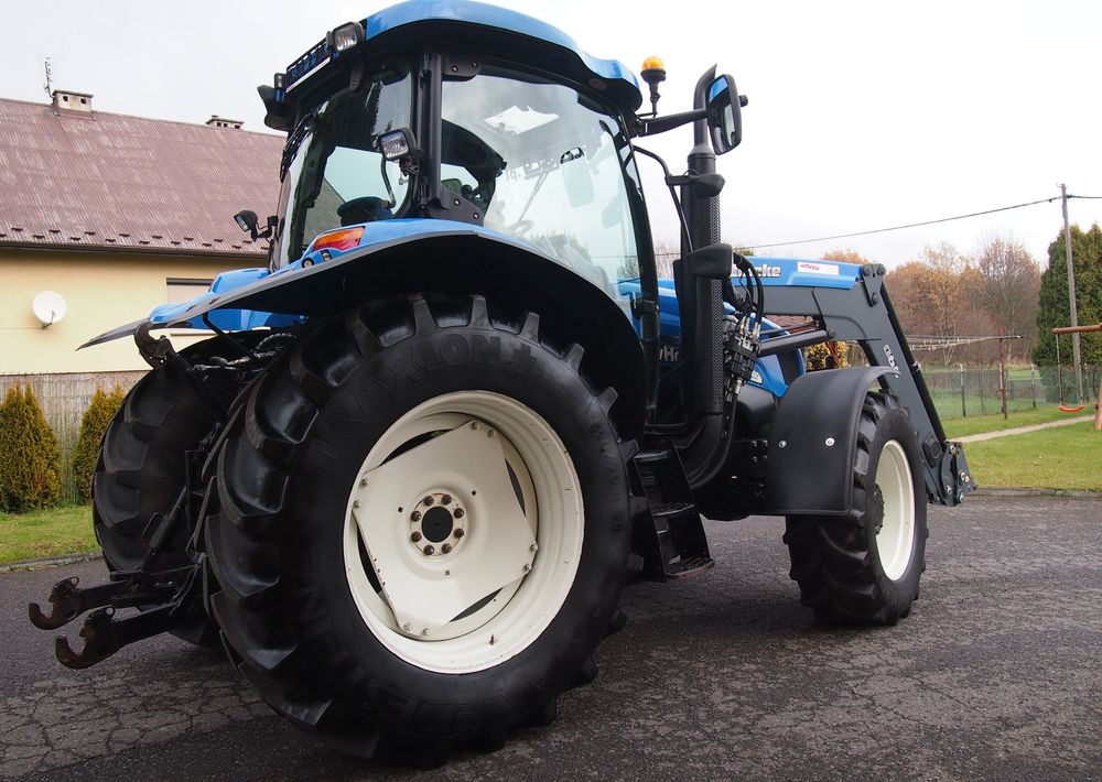 Ciągnik New Holland NH TS125A 6 cylindrów 2004 Ciągnik rolniczy New Holland TS125A - Traktör: fotoğraf 4 Ciągnik New Holland NH TS125A 6 cylindrów 2004 Ciągnik rolniczy New Holland TS125A - Traktör: fotoğraf 4