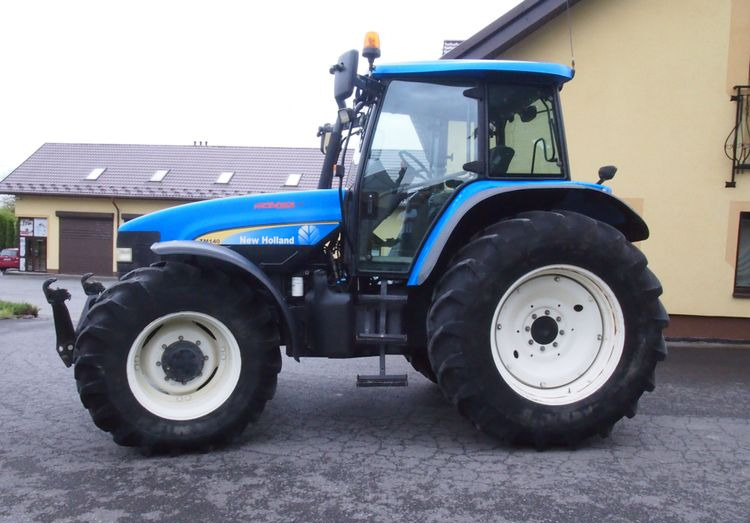 Ciągnik New Holland TM 140 2004 Przedni TUZ - Traktör: fotoğraf 5 Ciągnik New Holland TM 140 2004 Przedni TUZ - Traktör: fotoğraf 5