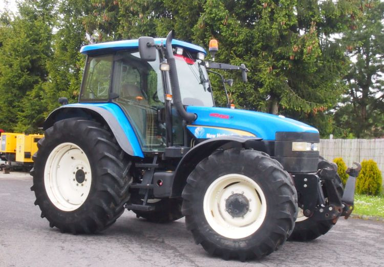 Ciągnik New Holland TM 140 2004 Przedni TUZ - Traktör: fotoğraf 1 Ciągnik New Holland TM 140 2004 Przedni TUZ - Traktör: fotoğraf 1