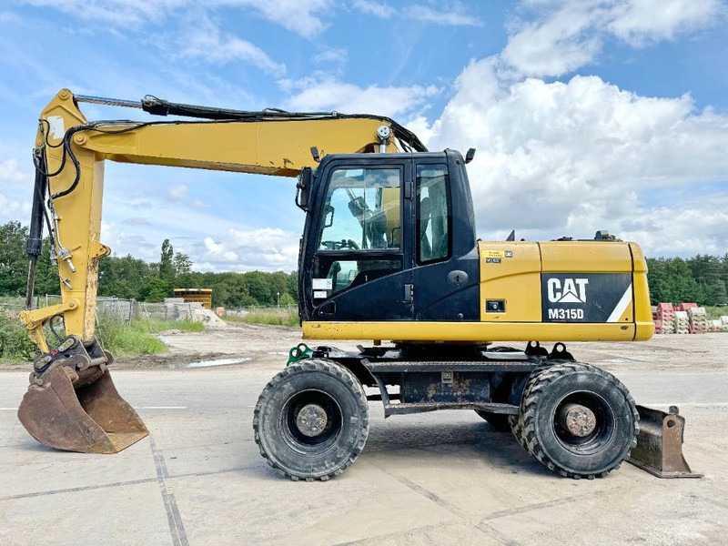 Cat M315D - Triple Boom / Quick Coupler - Tekerlekli ekskavatör: fotoğraf 1 Cat M315D - Triple Boom / Quick Coupler - Tekerlekli ekskavatör: fotoğraf 1