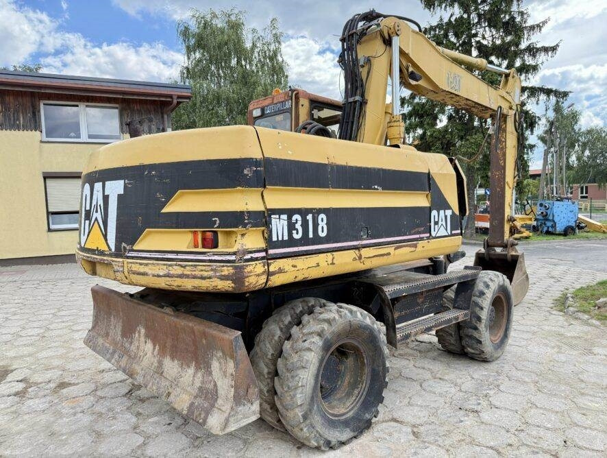 CAT M318 - Tekerlekli ekskavatör: fotoğraf 1 CAT M318 - Tekerlekli ekskavatör: fotoğraf 1