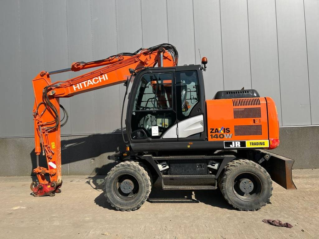 Hitachi ZX 140 W-5B - Tekerlekli ekskavatör: fotoğraf 1 Hitachi ZX 140 W-5B - Tekerlekli ekskavatör: fotoğraf 1