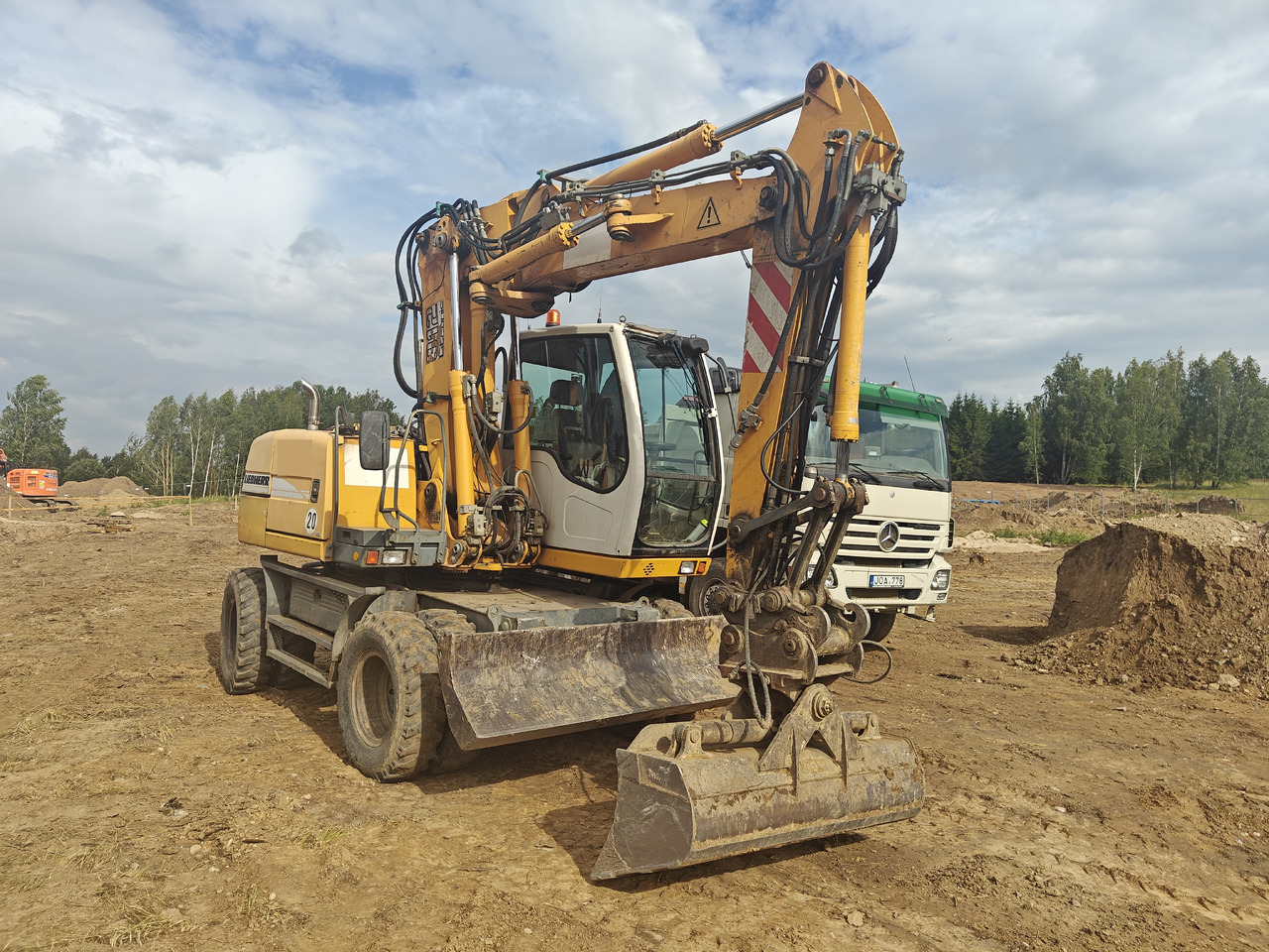 LIEBHERR A312 - Tekerlekli ekskavatör: fotoğraf 1 LIEBHERR A312 - Tekerlekli ekskavatör: fotoğraf 1