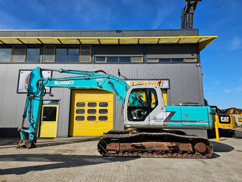 Kobelco SK210LC-6 - Paletli ekskavatör: fotoğraf 1 Kobelco SK210LC-6 - Paletli ekskavatör: fotoğraf 1