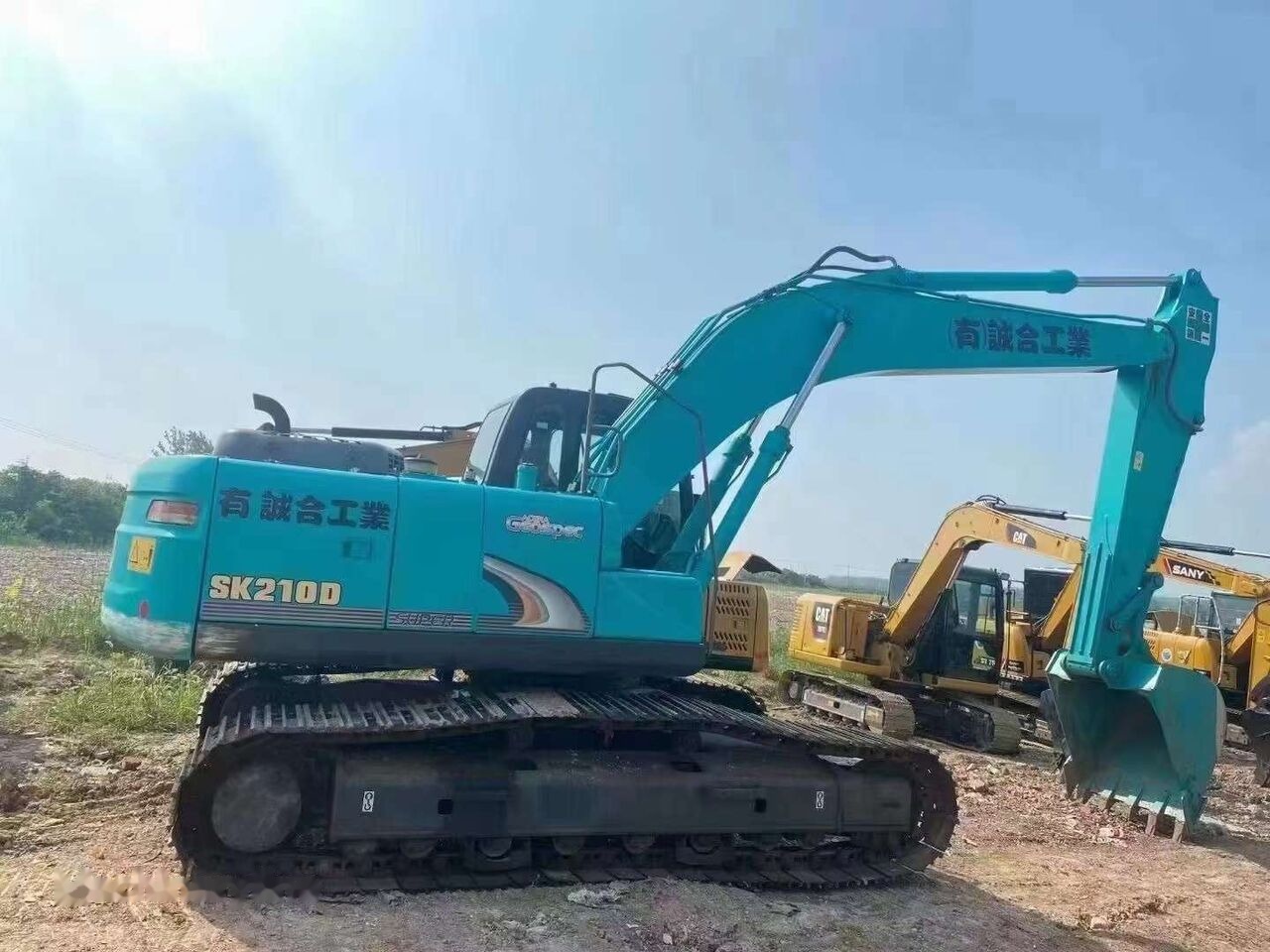 Kobelco SK210D - Paletli ekskavatör: fotoğraf 3 Kobelco SK210D - Paletli ekskavatör: fotoğraf 3