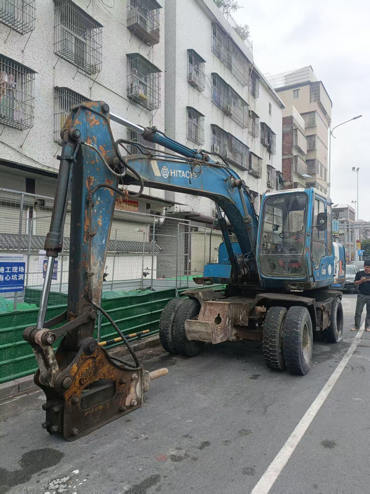 HITACHI EX100WD-2 - Tekerlekli ekskavatör: fotoğraf 1 HITACHI EX100WD-2 - Tekerlekli ekskavatör: fotoğraf 1