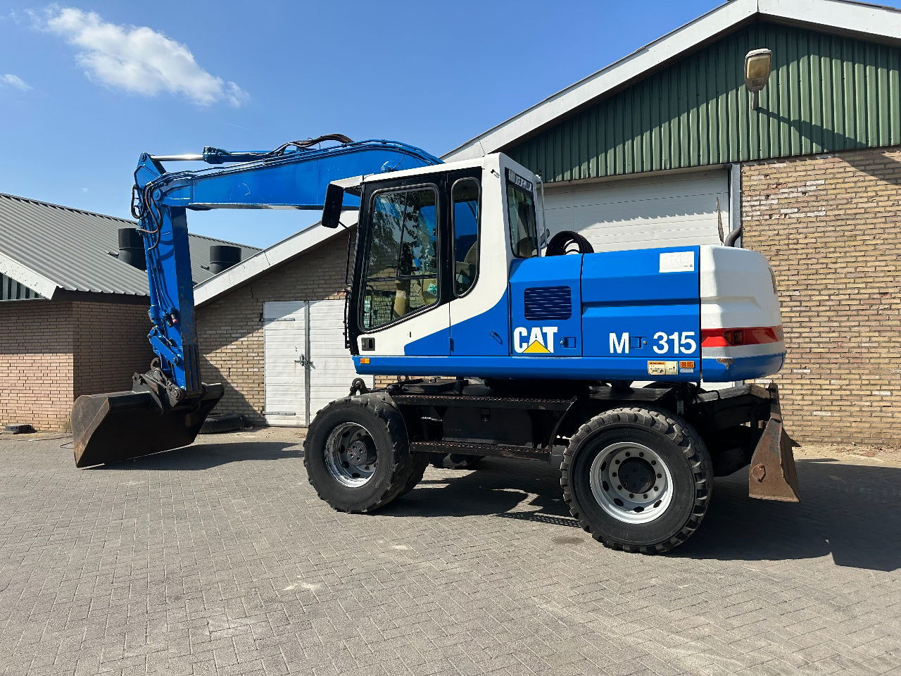 Caterpillar M315 - Tekerlekli ekskavatör: fotoğraf 4 Caterpillar M315 - Tekerlekli ekskavatör: fotoğraf 4