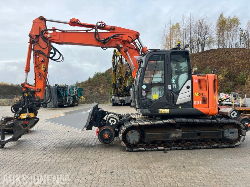 2015 Hitachi ZX135-US Rail maskin med henger, tilt, klype, 6 skuffer, klype - Ekskavatör: fotoğraf 2 2015 Hitachi ZX135-US Rail maskin med henger, tilt, klype, 6 skuffer, klype - Ekskavatör: fotoğraf 2