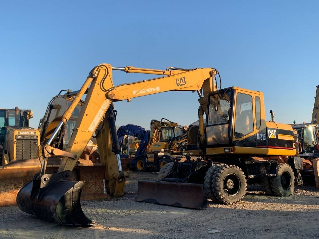 CAT M 315 - Tekerlekli ekskavatör: fotoğraf 2 CAT M 315 - Tekerlekli ekskavatör: fotoğraf 2