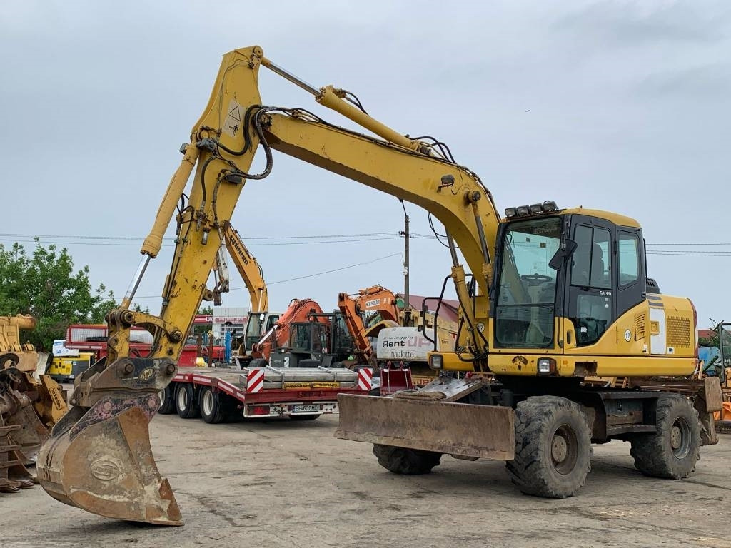Komatsu PW 140-7 - Tekerlekli ekskavatör: fotoğraf 1 Komatsu PW 140-7 - Tekerlekli ekskavatör: fotoğraf 1