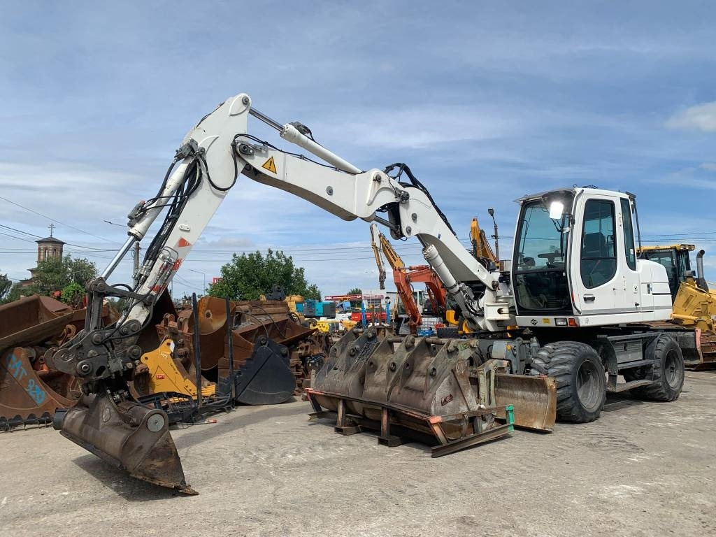 Liebherr A 311 Litronic - Tekerlekli ekskavatör: fotoğraf 1 Liebherr A 311 Litronic - Tekerlekli ekskavatör: fotoğraf 1