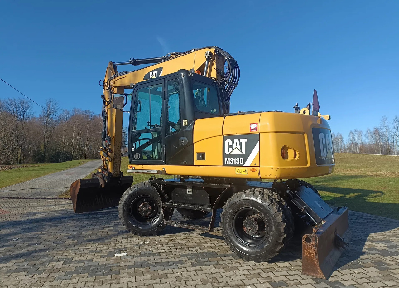 CATERPILLAR M313D - Tekerlekli ekskavatör: fotoğraf 1 CATERPILLAR M313D - Tekerlekli ekskavatör: fotoğraf 1