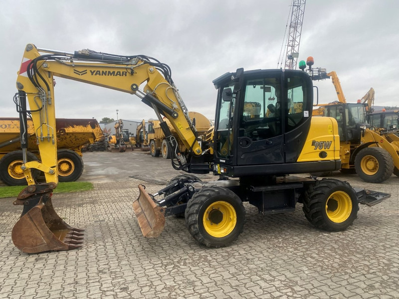 Yanmar B95w NVT - Tekerlekli ekskavatör: fotoğraf 1 Yanmar B95w NVT - Tekerlekli ekskavatör: fotoğraf 1