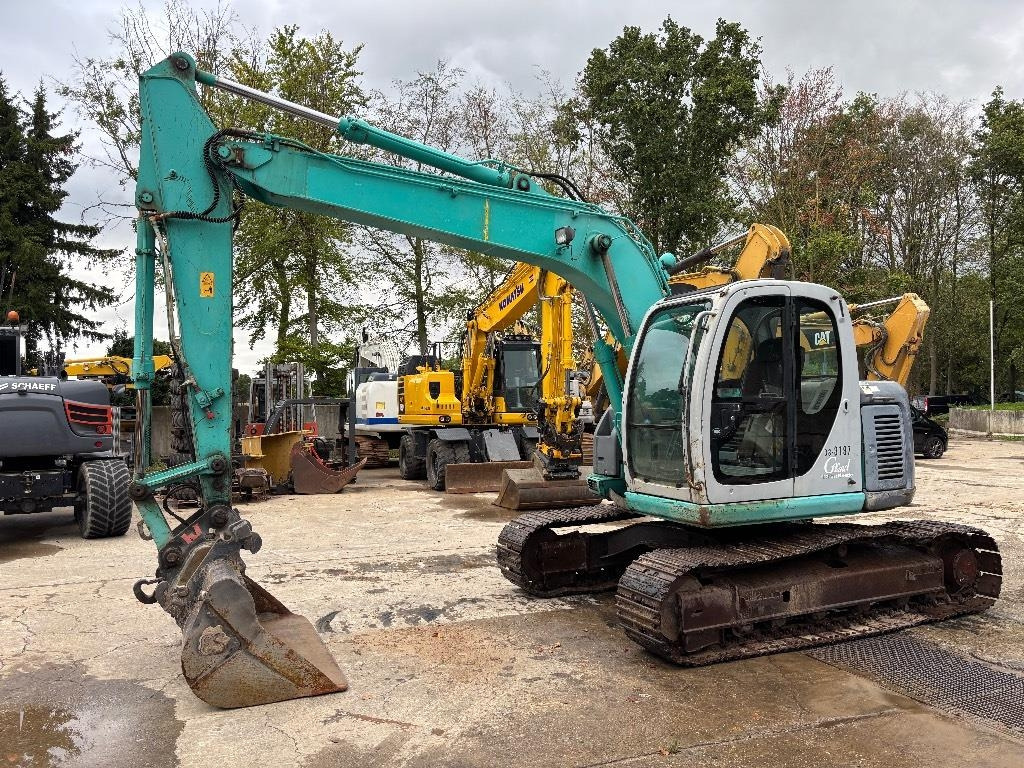 Kobelco SK 135 - Paletli ekskavatör: fotoğraf 1 Kobelco SK 135 - Paletli ekskavatör: fotoğraf 1