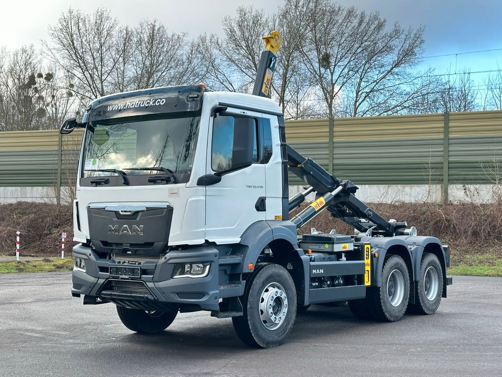 MAN TGS 33.440 6x4 Euro6e Abrollkipper Hyva - Kancalı yükleyici kamyon, Vinçli kamyon: fotoğraf 1 MAN TGS 33.440 6x4 Euro6e Abrollkipper Hyva - Kancalı yükleyici kamyon, Vinçli kamyon: fotoğraf 1