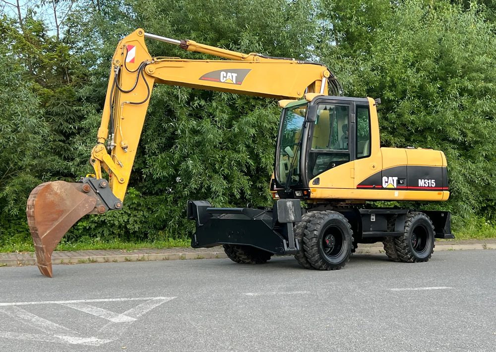 Caterpillar CAT M315C CATERPILLAR SPROWADZONY Bardzo Dobry Stan - Tekerlekli ekskavatör: fotoğraf 1 Caterpillar CAT M315C CATERPILLAR SPROWADZONY Bardzo Dobry Stan - Tekerlekli ekskavatör: fotoğraf 1