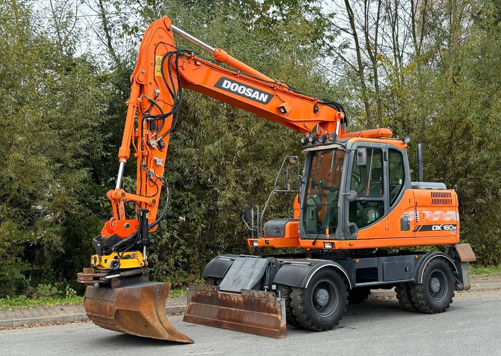 Doosan * DOOSAN DX160W *ROTOTILT* GPS 2D Leica * Sprowadzona * Stan Perfekcyjny * Koparka Kołowa * - Tekerlekli ekskavatör: fotoğraf 1 Doosan * DOOSAN DX160W *ROTOTILT* GPS 2D Leica * Sprowadzona * Stan Perfekcyjny * Koparka Kołowa * - Tekerlekli ekskavatör: fotoğraf 1