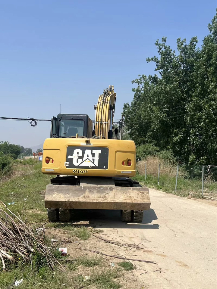 CATERPILLAR M317D2 - Tekerlekli ekskavatör: fotoğraf 1 CATERPILLAR M317D2 - Tekerlekli ekskavatör: fotoğraf 1
