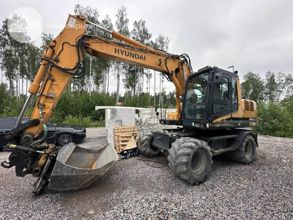 Hyundai Robex 140 W-7 A - Tekerlekli ekskavatör: fotoğraf 1 Hyundai Robex 140 W-7 A - Tekerlekli ekskavatör: fotoğraf 1