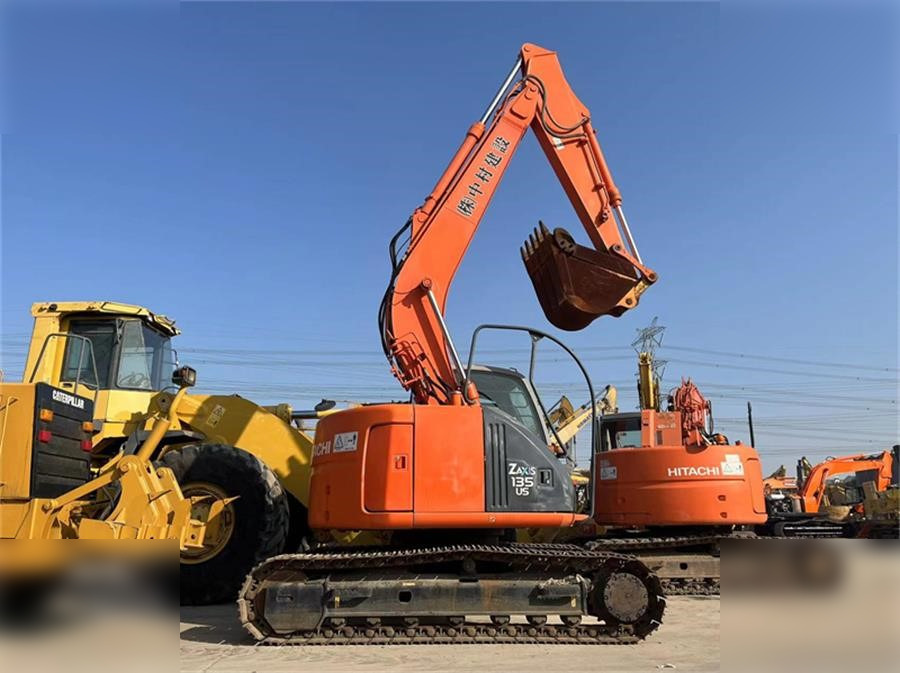HITACHI ZX135US - Paletli ekskavatör: fotoğraf 1 HITACHI ZX135US - Paletli ekskavatör: fotoğraf 1