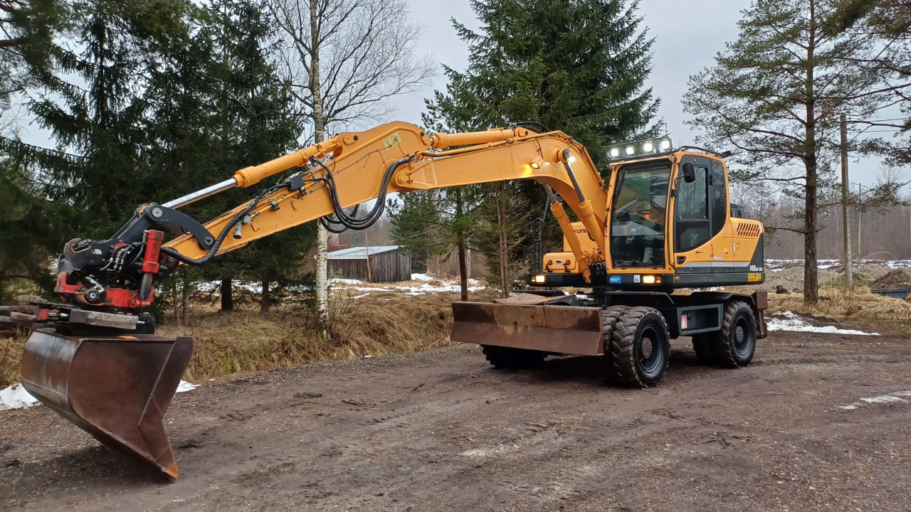 Hyundai Robex 140W-9A - Tekerlekli ekskavatör: fotoğraf 1 Hyundai Robex 140W-9A - Tekerlekli ekskavatör: fotoğraf 1