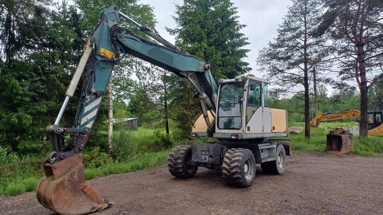 Volvo EW140 - Tekerlekli ekskavatör: fotoğraf 1 Volvo EW140 - Tekerlekli ekskavatör: fotoğraf 1