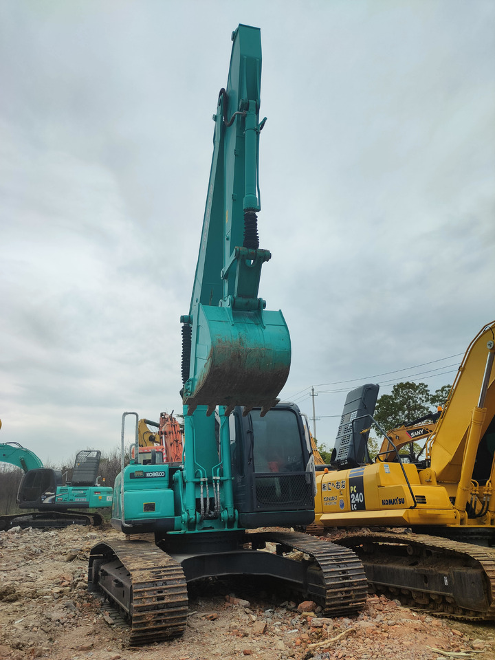 KOBELCO SK210D - Paletli ekskavatör: fotoğraf 1 KOBELCO SK210D - Paletli ekskavatör: fotoğraf 1