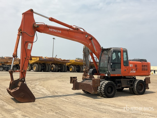 2005 Hitachi ZX210W - Tekerlekli ekskavatör: fotoğraf 1 2005 Hitachi ZX210W - Tekerlekli ekskavatör: fotoğraf 1