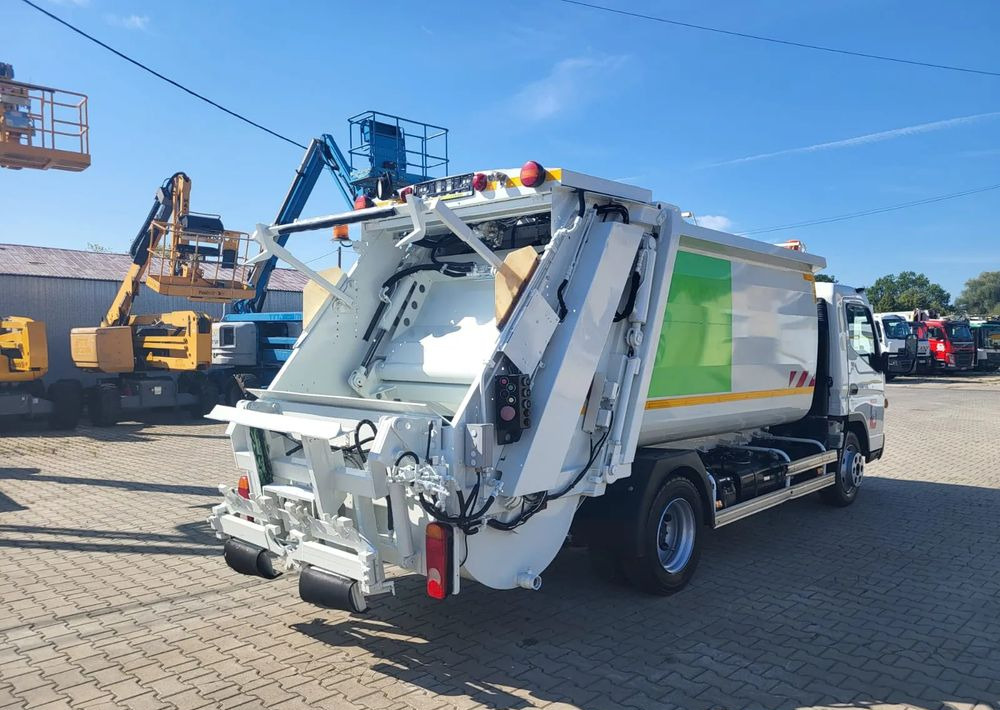Mitsubishi Fuso Canter - Çöp kamyonu: fotoğraf 5 Mitsubishi Fuso Canter - Çöp kamyonu: fotoğraf 5