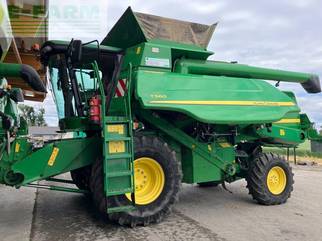 John Deere T560HM - Biçerdöver: fotoğraf 1 John Deere T560HM - Biçerdöver: fotoğraf 1