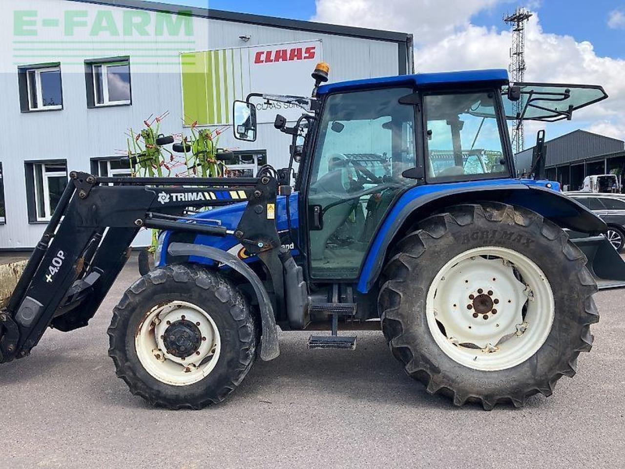 New Holland tl 100 a A - Traktör: fotoğraf 1 New Holland tl 100 a A - Traktör: fotoğraf 1
